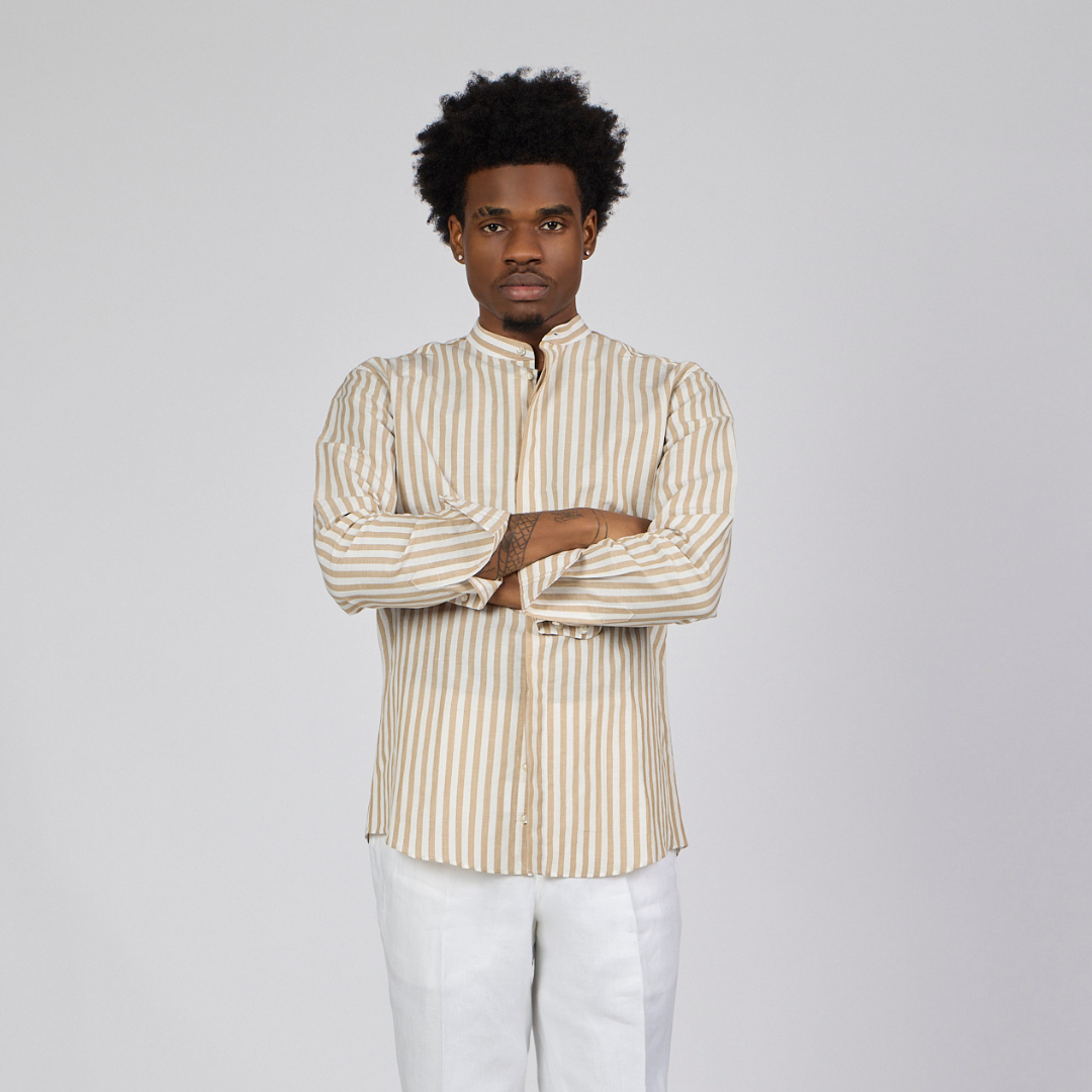 Man wearing a beige and white striped shirt against a plain background-2